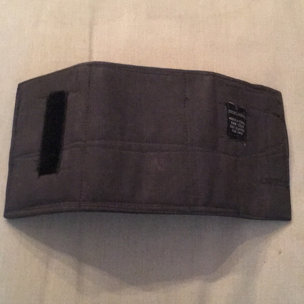 Grey fabric wallet with pockets and velcro closure